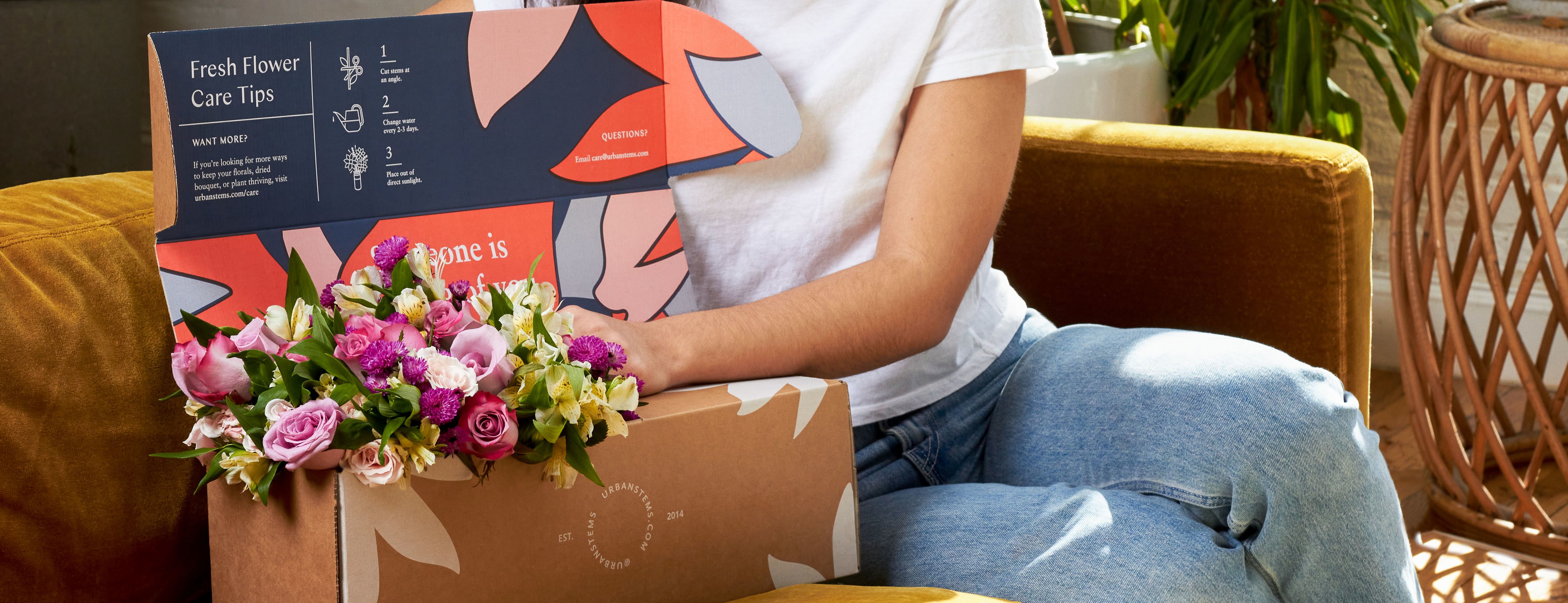 Woman sending herself UrbanStems flowers for self-love