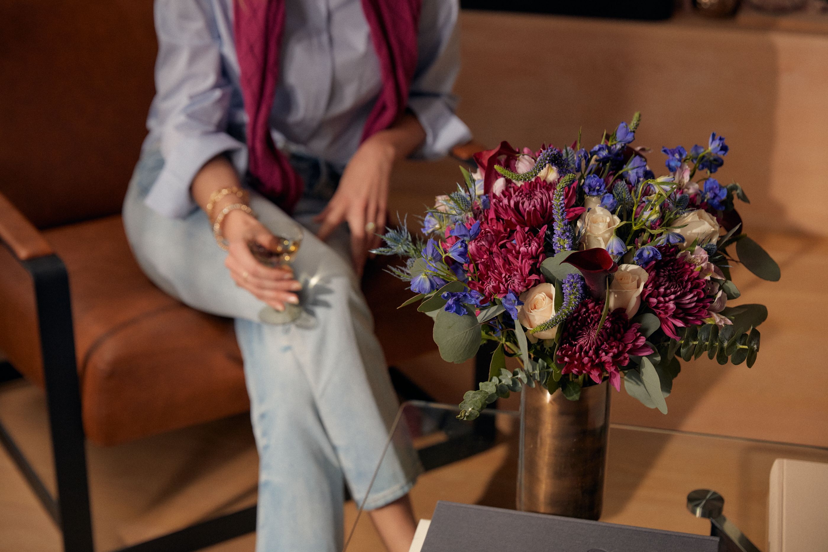 Lifestyle image of woman and UrbanStems bouquet, The Selene.