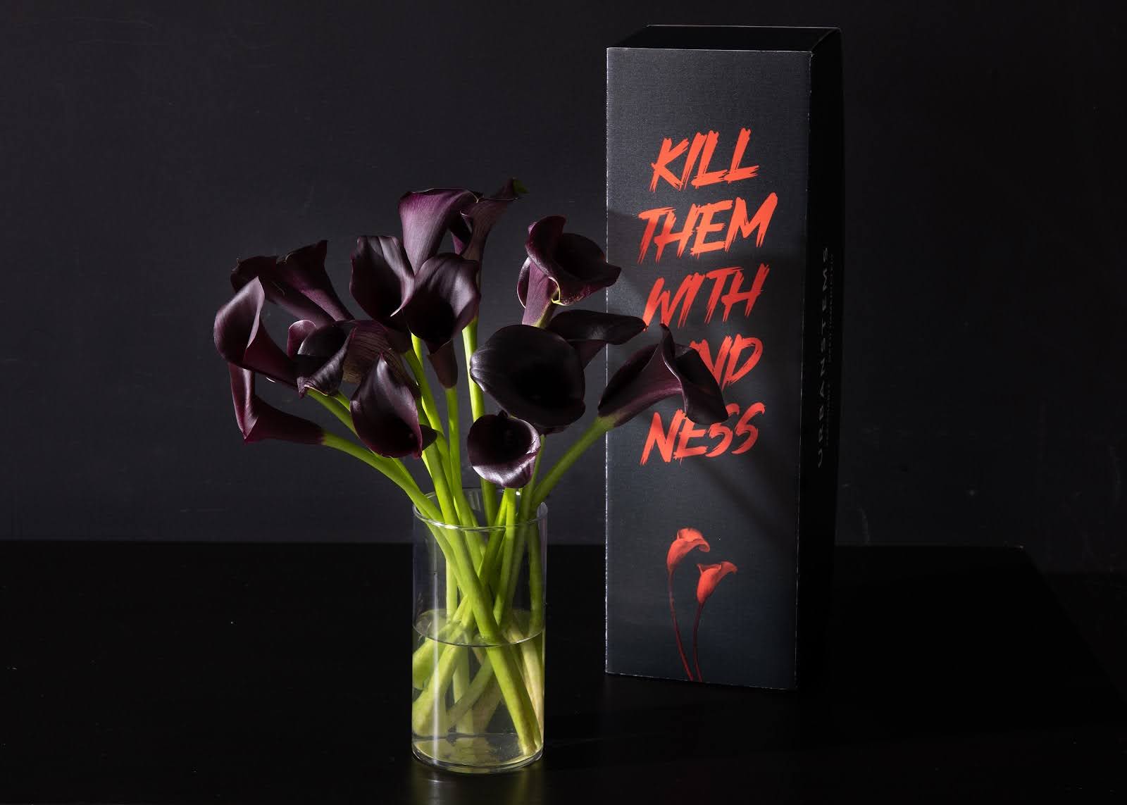 Close up of Halloween bouquet of Midnight Calla Lilies.