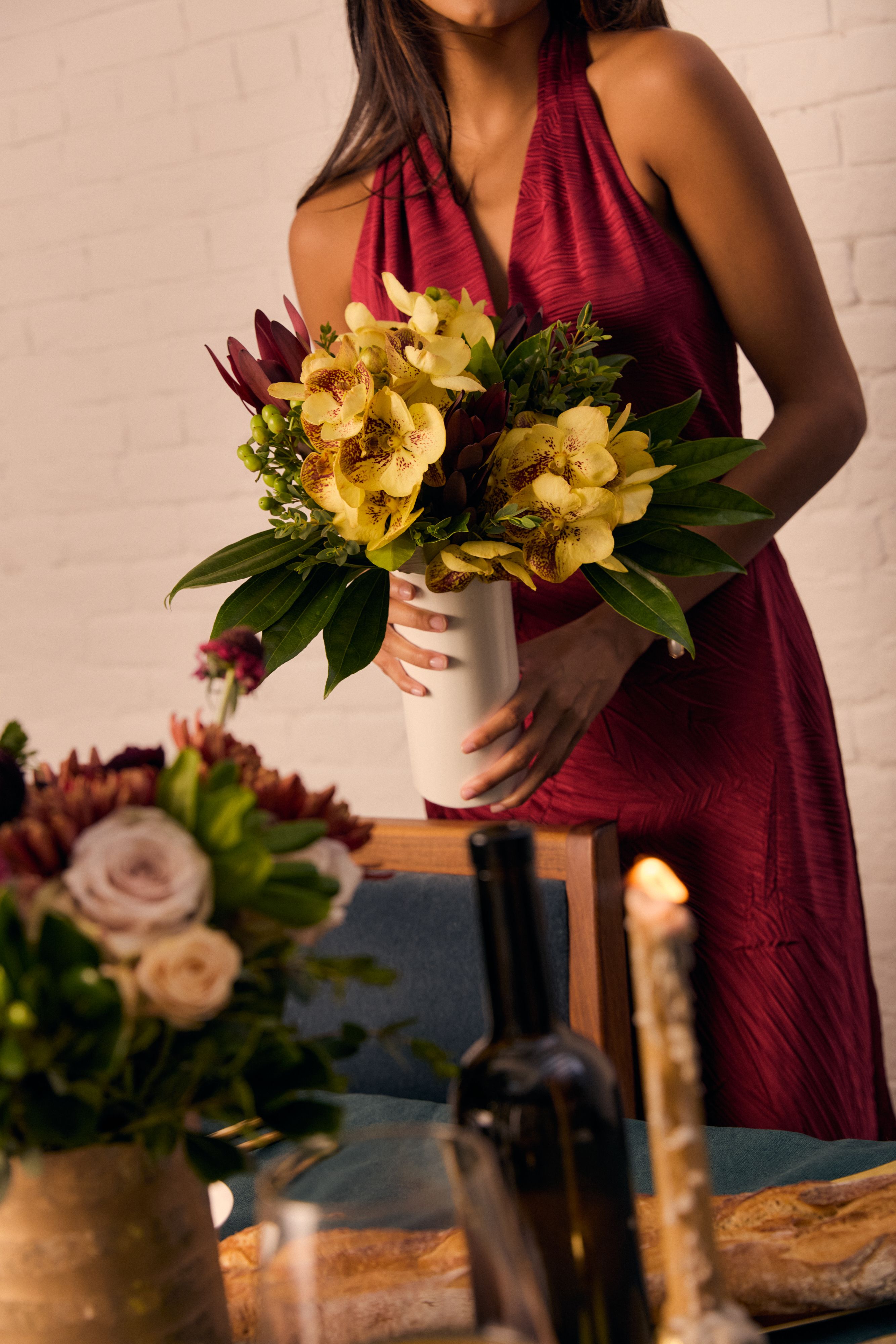 Close up of a woman holding The Exotic Orchid.