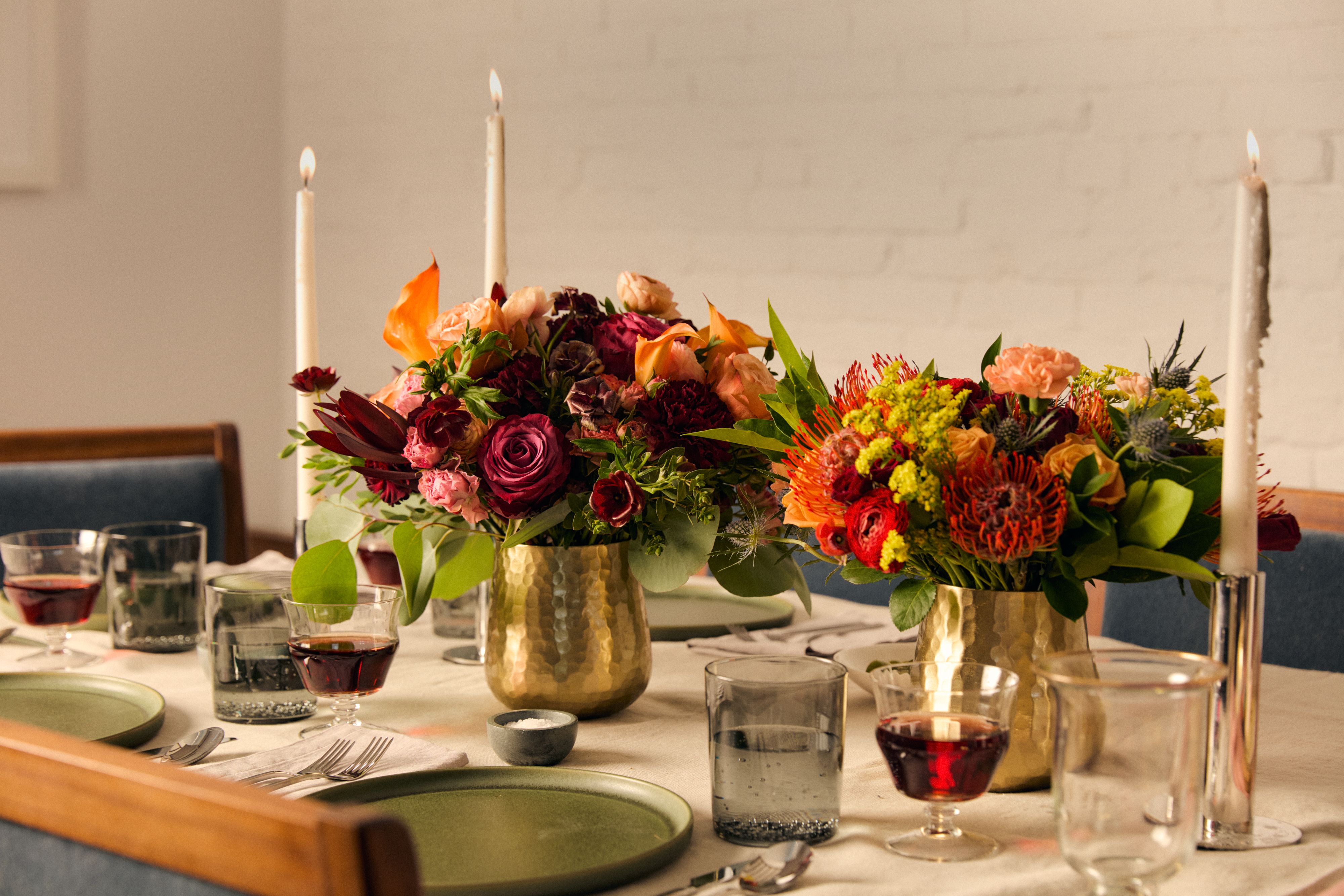 Close up of two colorful fall centerpieces by UrbanStems