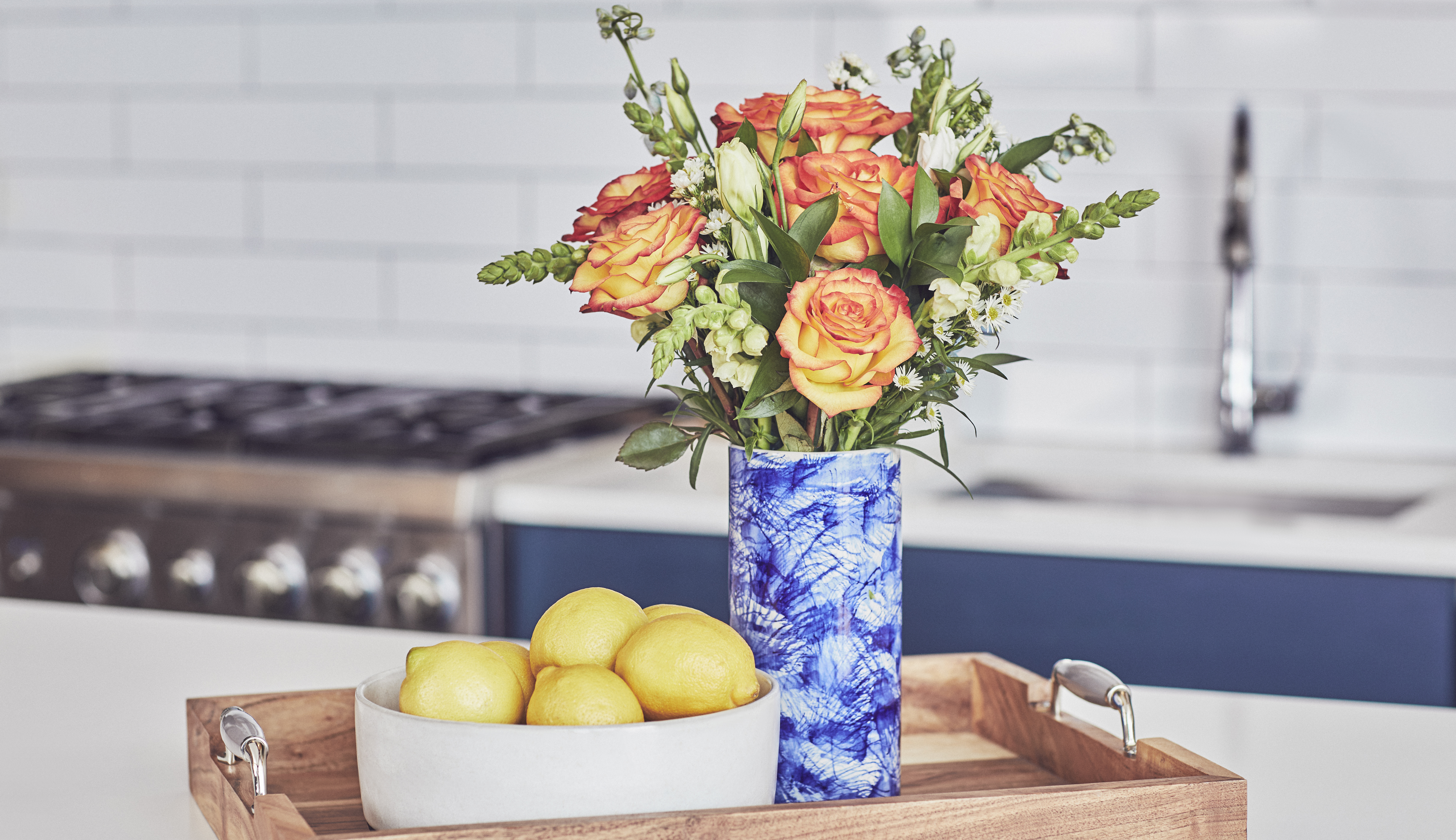 Fresh flowers in blue vase