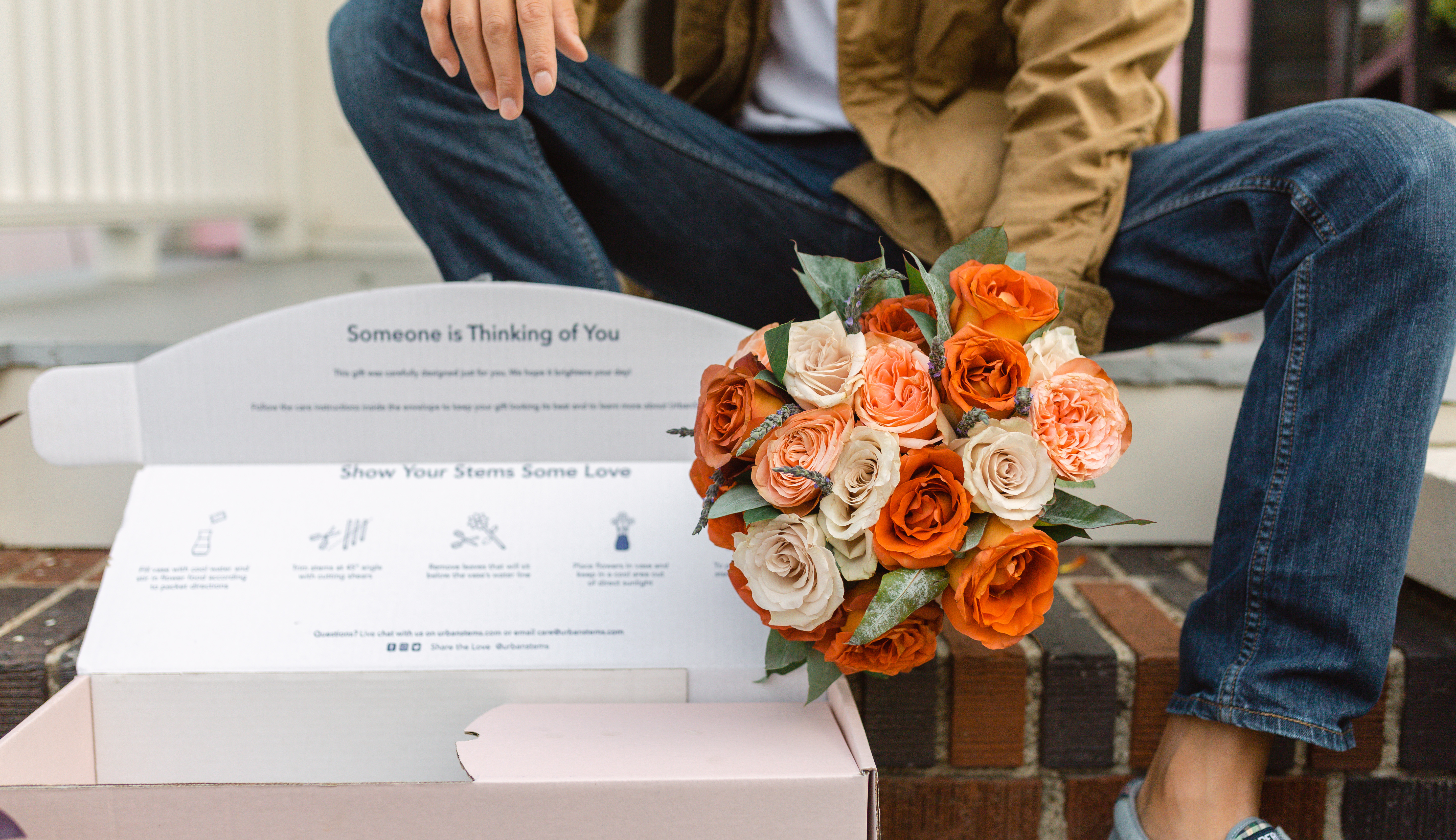 Orange and white flower bouquet in pink same day delivery box