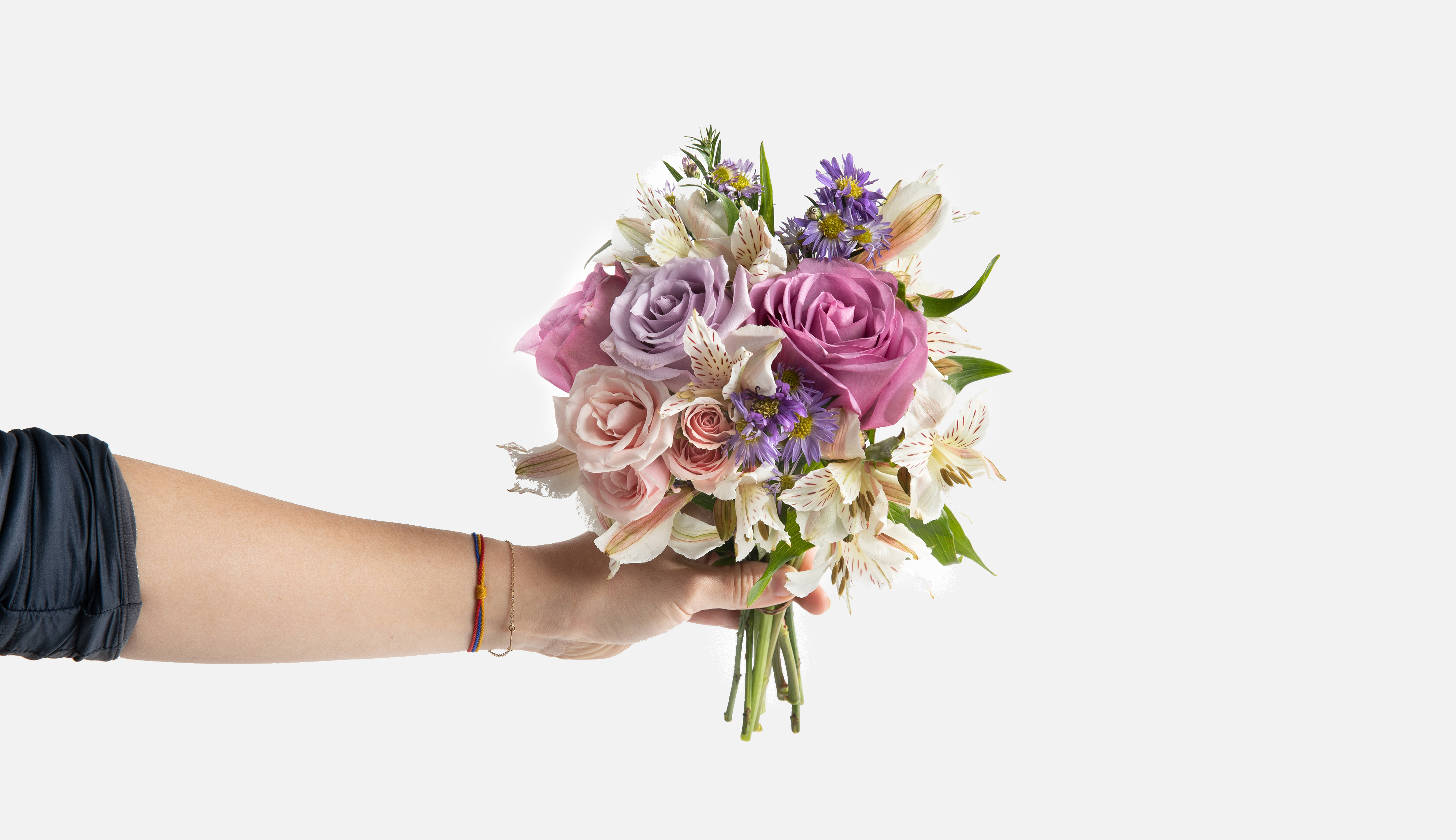 Hand holding a mini bouquet