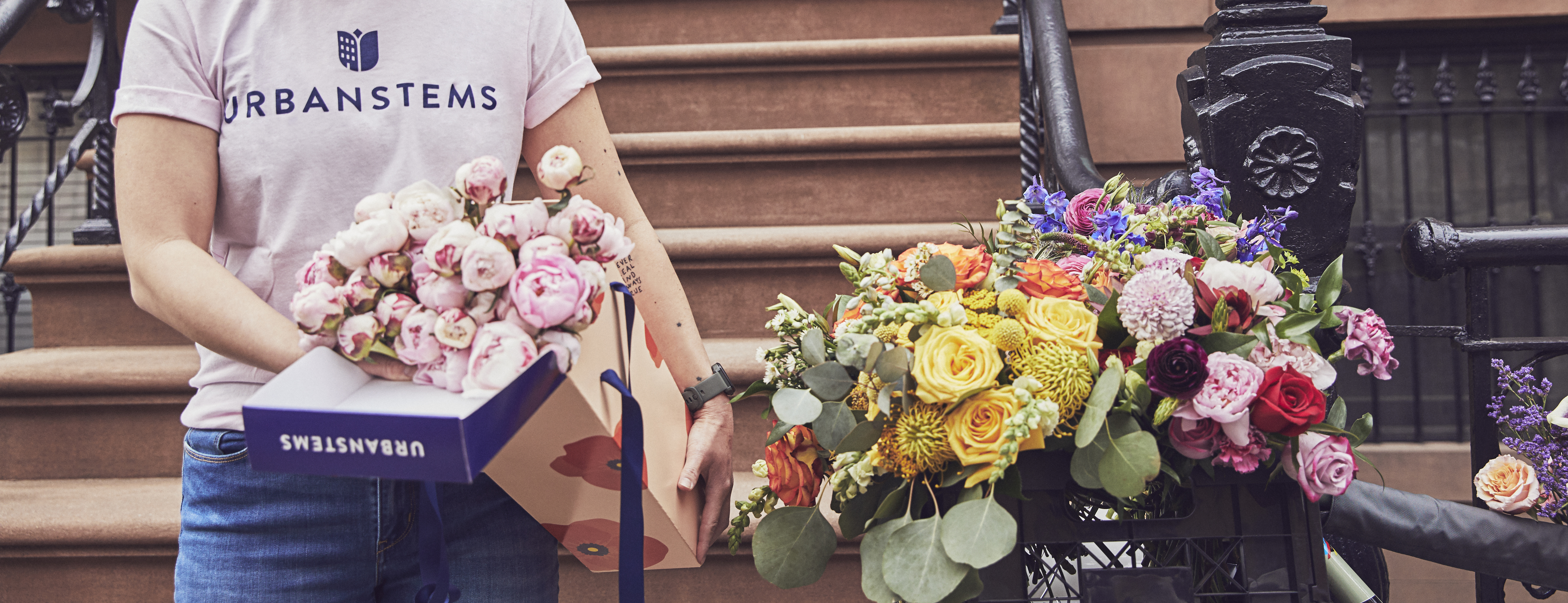 Boxes of flowers being delivered right to the doorstep via UrbanStems same-day delivery