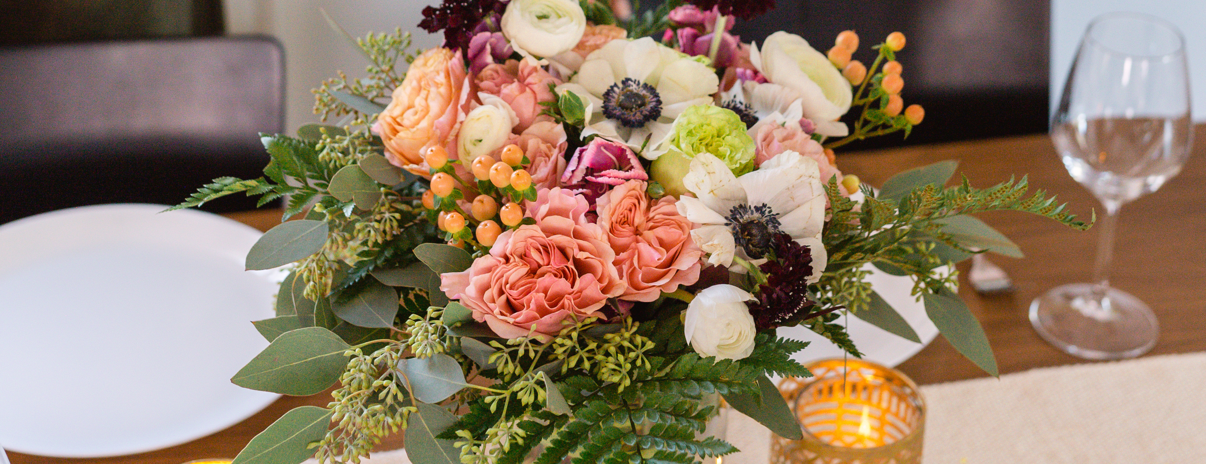 A colorful floral bouquet tablescape for wedding anniversary party
