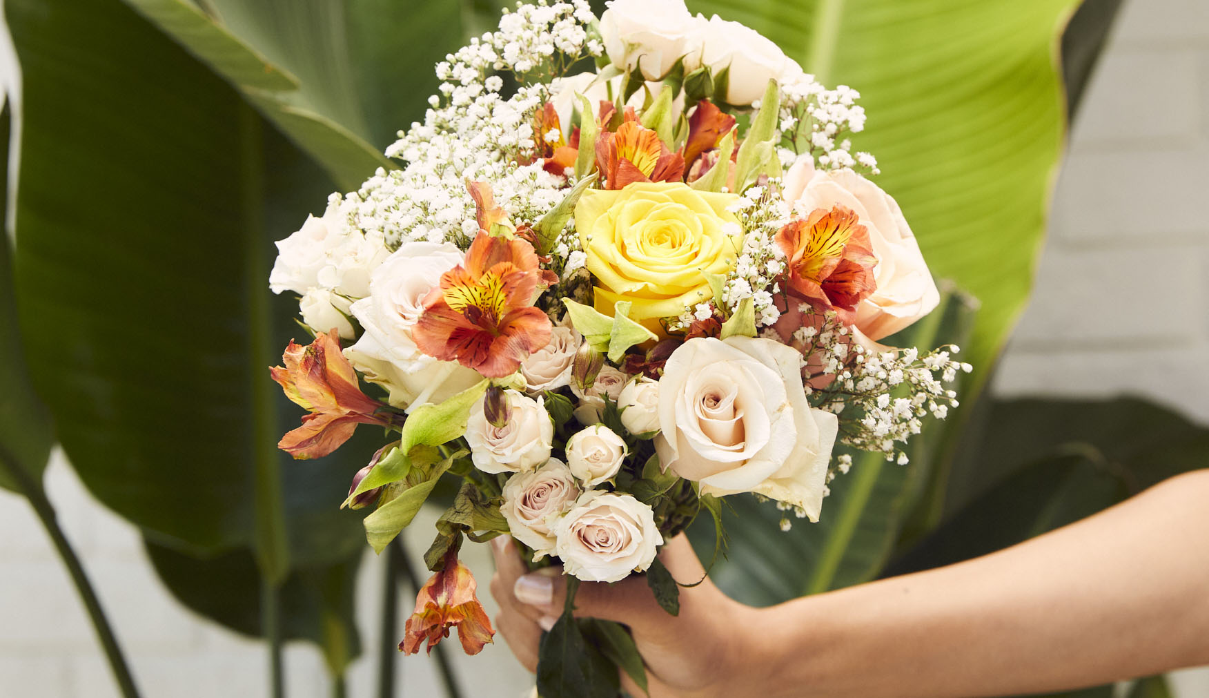Beautiful fall floral arrangement containing orange and white flowers