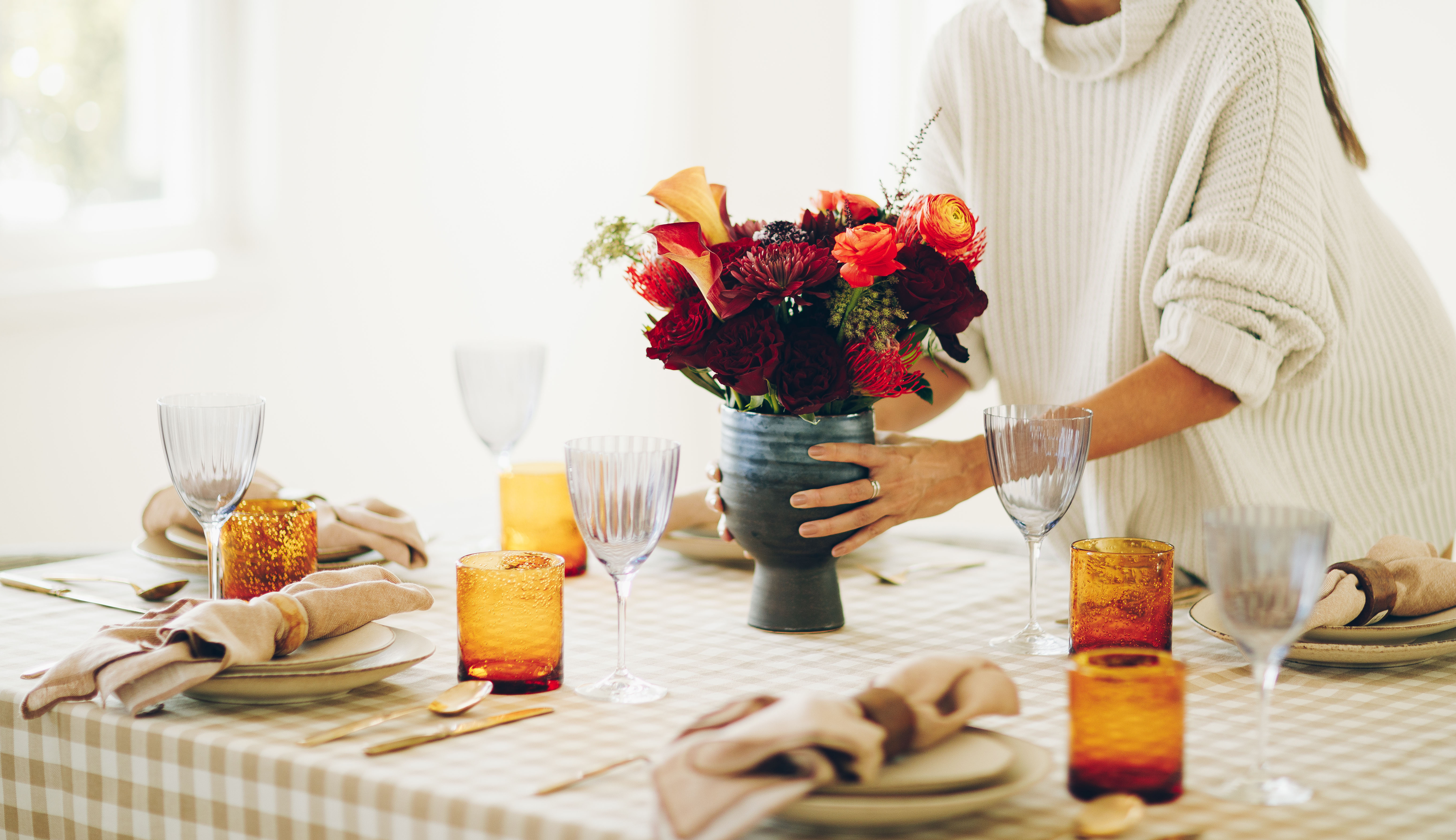 Floral mums centerpiece at decorated Thanksgiving table
