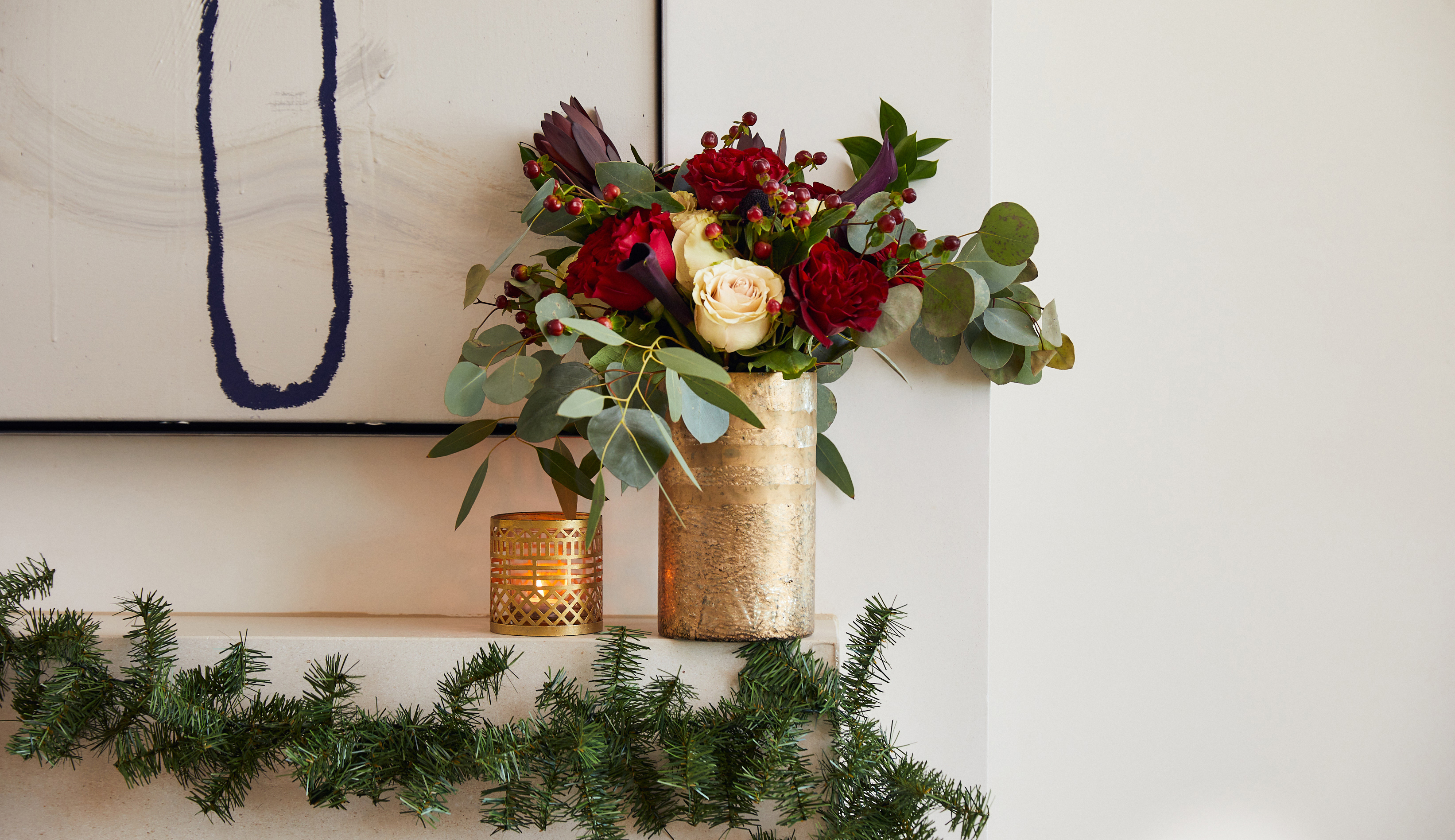 Mantel decorated with holiday flowers