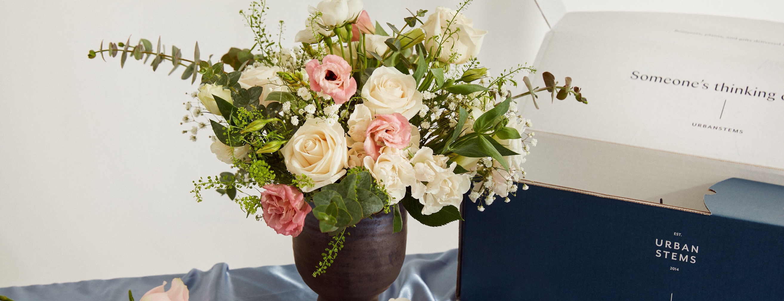 Romantic flower arrangement with a flower delivery box