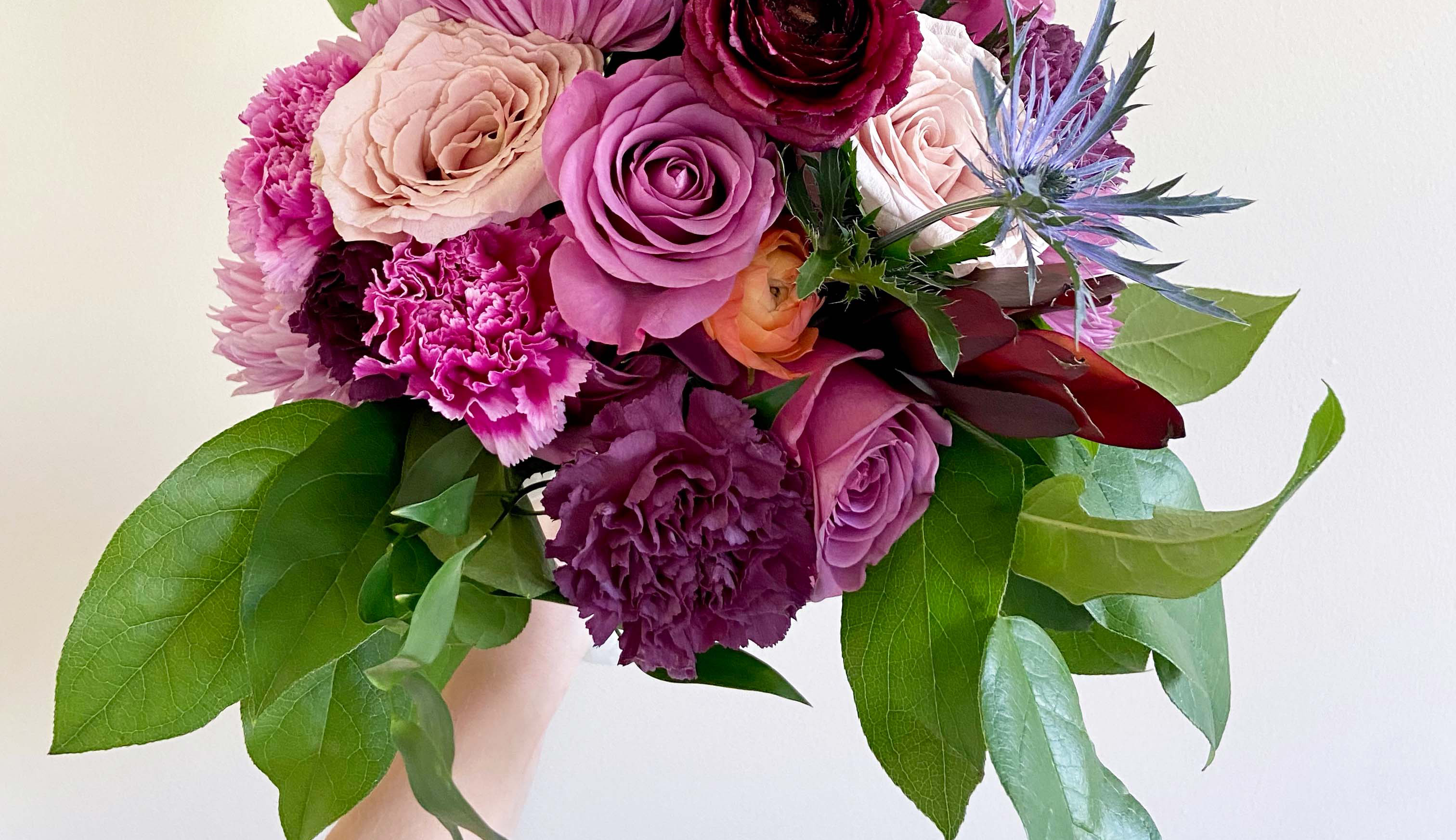 Close up of a purple bouquet for International Women's Day