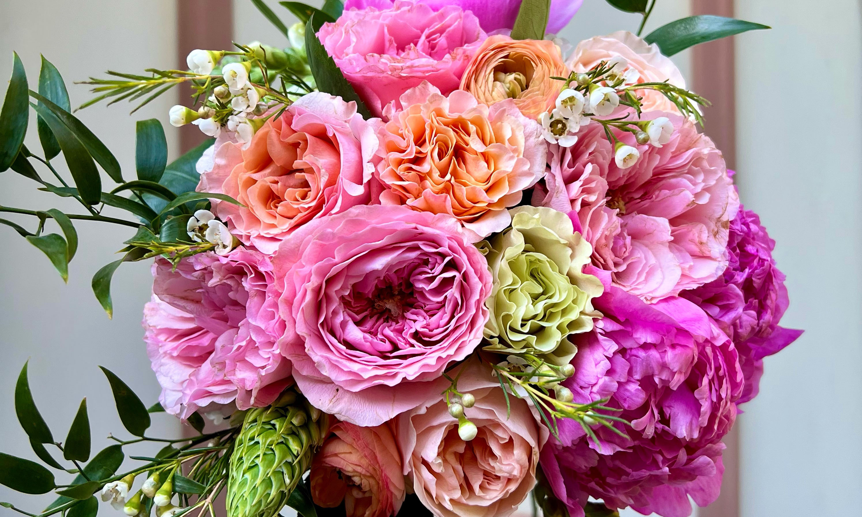Close up of bright peony bouquet. Send flowers online with UrbanStems same-day and next-day delivery