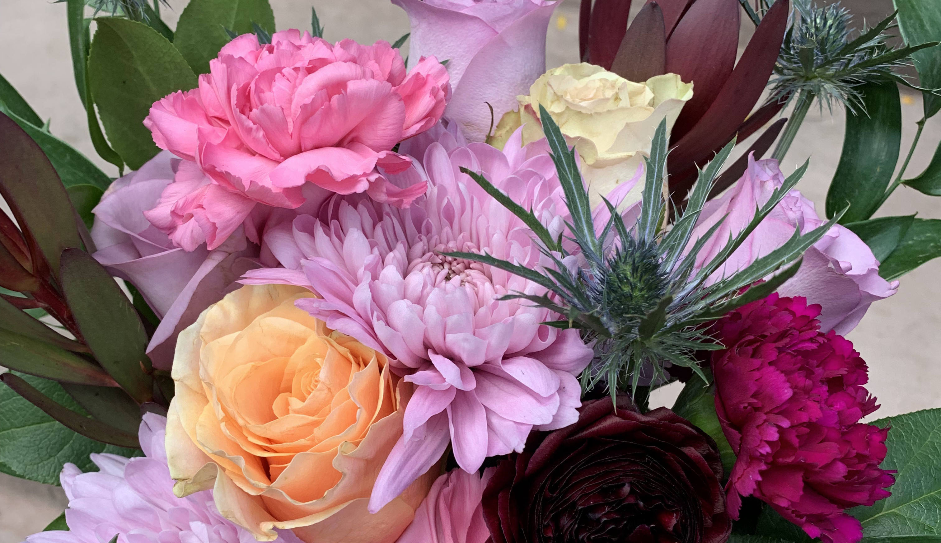 Close up of a bouquet containing January's birth flower, the carnation